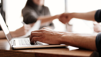 close up. businessman works on a laptop while sitting at an office Desk .