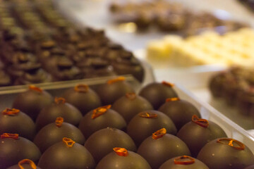 Chili and Coffee pralines at chocolate store in showcase