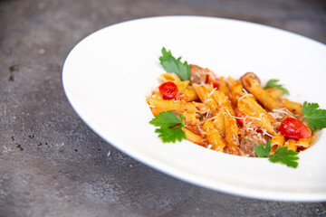 .pasta with herbs in a white plate