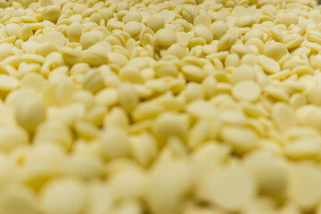 Field of many white chocolat pellets