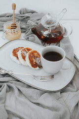 Curd cheesecakes on a gray plate