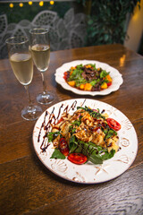  salad in a white plate with white wine