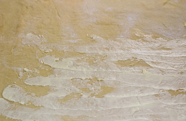 Rolled out and spread with butter and butter for baking.