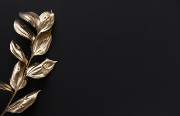 Golden painted leafs on black background. Minimal concept for wedding banner, invitation card template.