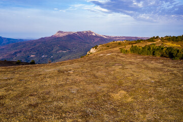 beautiful mountains at sunrise against the background of white clouds