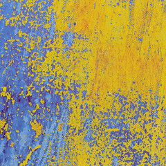 view of a patch of rusty iron with stains of old cracked yellow paint