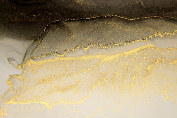 Abstract and gold glitter color background. Marble texture. Alcohol ink colors.