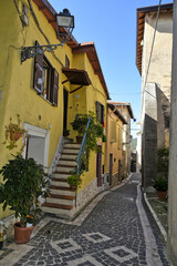 Fototapeta na wymiar An alley among the old houses of Fiuggi, a medieval village in the Lazio region.