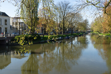 Fototapeta na wymiar The canal or Singel in Utrecht The Netherlands on a sunny spring day with trees and boats