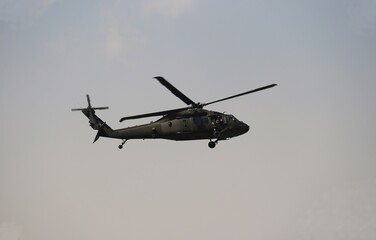 Naklejka na ściany i meble Black American Helicopter in Afghanistan