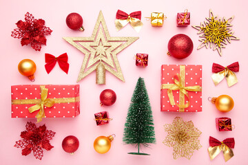 Christmas composition made of christmas decoration on pink background. Flat lay