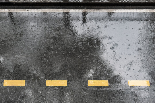 Asphalt road with rain from above view