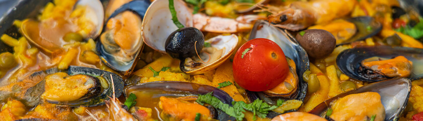Spanish seafood Paella de Marisco, Paella Marinera with Tomato and olives