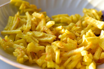 Ruddy delicious crispy French fries just fried close up