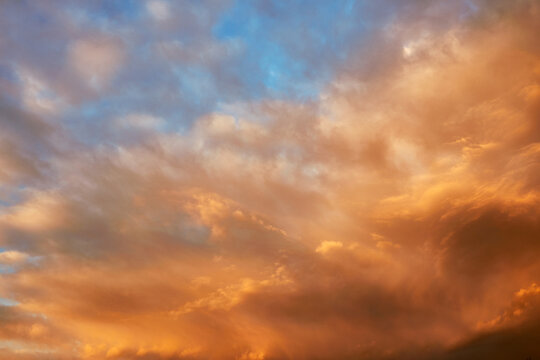 Blue Sky At Sunset With Orange Clouds