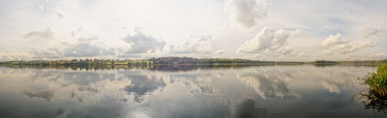 Panoramic view of lake on hazy autumn day