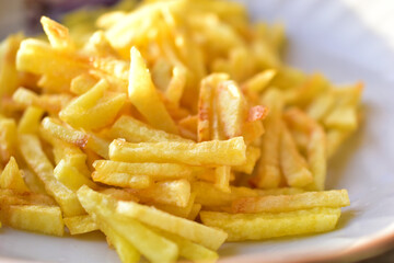 Ruddy delicious crispy French fries just fried close up