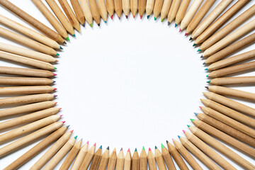 Wooden pencil collection for painting isolated on white background. Back to school concept. Horizontal view of sorted pencils drawing a circle by different color and shape.