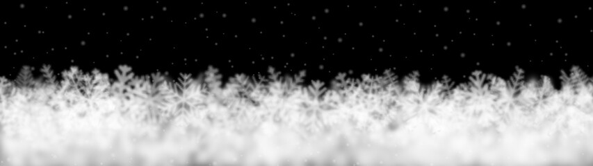 Christmas background of snowflakes of different shape, blur and transparency, located bottom, on black background