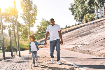 Father and kid going on a walk outside