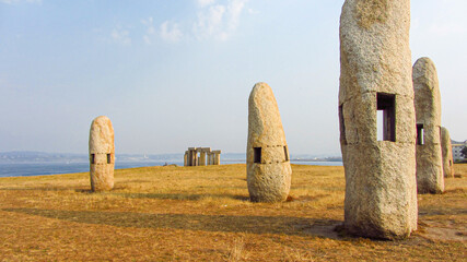 Menhirs on the rat field (Campo de la Rata) in La Coruna Spain, monument in honor of the victims during dictatorship. Stone dolmens field at evening.