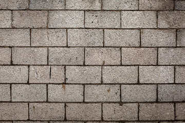 Old grey breeze block wall