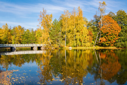 Autumn view of the river and white wooden bridge, Stromfors Iron Works, Loviisa, Finland