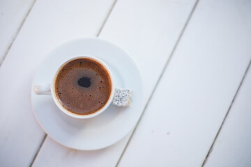 Turkish coffee and tahini donut on a white background.