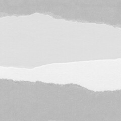 White torn paper collage close-up. Texture made from various paper and cardboard parts. Damaged old paper background. Vintage blank wallpaper. Material design backdrop.