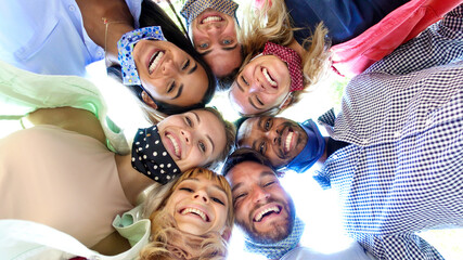 Diverse people wearing face mask taking a selfie - Portrait of a group of young friends having fun...