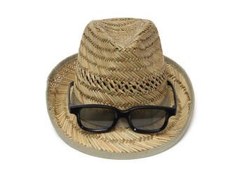 Retro style straw hat and sunglasses. Isolated objects on white background