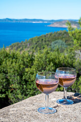 Picnic with of local rose wine and blue Mediterranean sea on background, near Saint-Tropez, Var, Provence, France