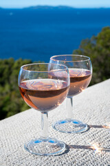 Picnic with of local rose wine and blue Mediterranean sea on background, near Saint-Tropez, Var, Provence, France
