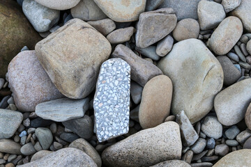 Various types of stones by the river.