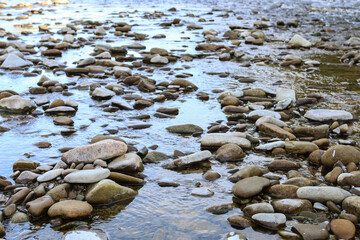 Various types of stones by the river.