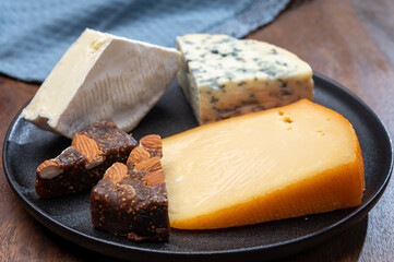Cheese collection, blue cheese, camembert, brie served as dessert with fig almonds bread