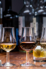 Tasting glass with strong alcoholic spirit drink whisky, cognac, armagnac or calvados