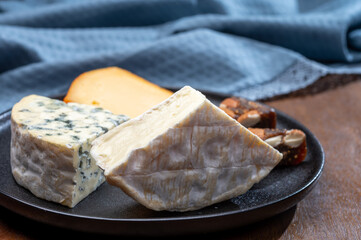 Cheese collection, blue cheese, camembert, brie served as dessert with fig almonds bread