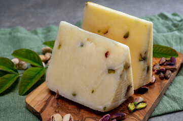 Cheese collection, fresh Italian pecorino cheese made from sheep milk filled with pistachio nuts...