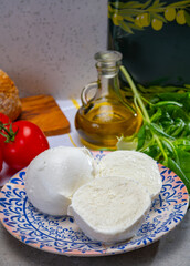 Fresh handmade soft Italian cheese from Campania, white balls of buffalo mozzarella cheese made from cow milk ready to eat
