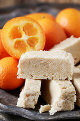 Sweet turkish dessert - halva and kumquat.