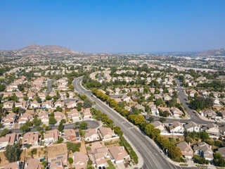 Aerial view of Southern California houses in inland town Corona, during hot summer. USA