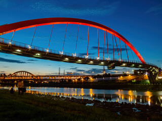 Fototapeta na wymiar Twilight view of the beautiful Rainbow Bridge