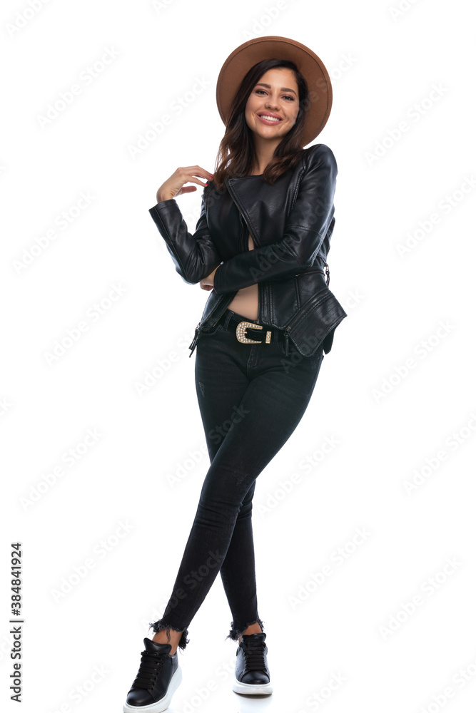 Wall mural Happy casual woman laughing, wearing hat and leather jacket