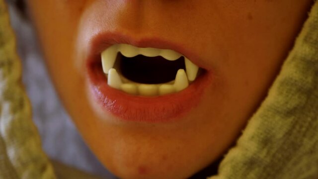Close Up View Of Toy Vampire Teeth In Childs Mouth Halloween Prank Concept  Sweden Stock Photo - Download Image Now - iStock