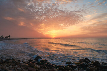 Rocky beach at sunrise, colors