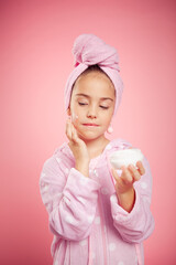 girl in a terry dressing gown and with a towel wrapped around her head