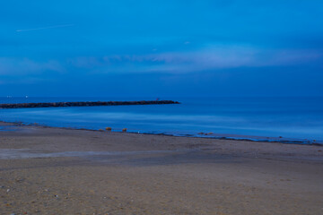 Breakwater on the beach at dusk