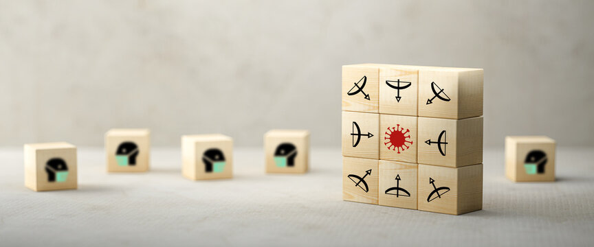 many cubes with people in face masks symbols and symbols to fight a virus on concrete background