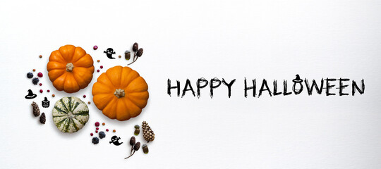 Autumn decoration with message HAPPY HALLOWEEN on white background